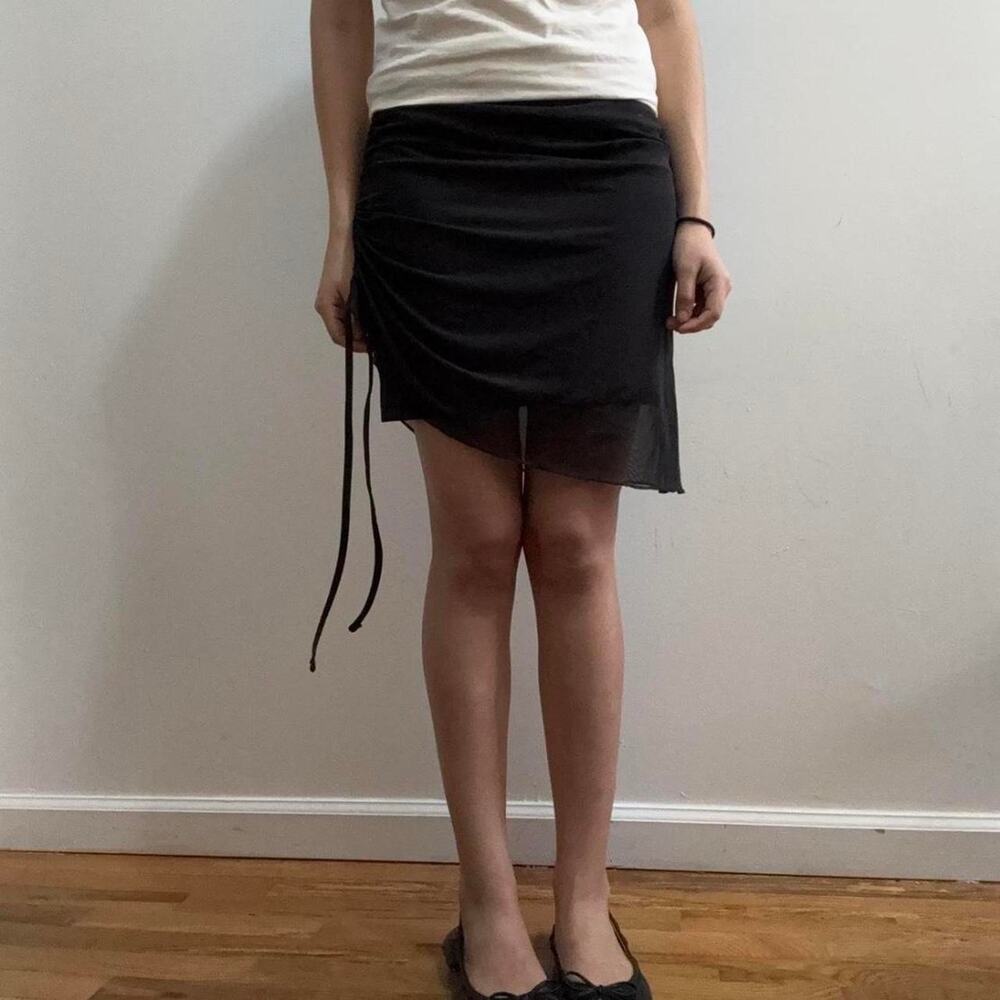 Black asymmetrical ruched mini skirt